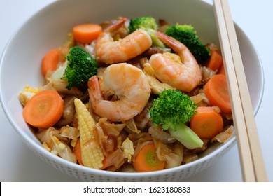 Traditional Thai Street Food Seafood Pad See Ew. Thai Stir Fried Noodles With Vegetables Isolated On White Background. Phat Si Io.