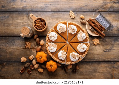 Traditional Thanksgiving Pumpkin Pie Cut Into Slices Overhead View