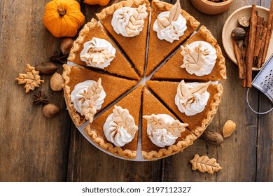 Traditional Thanksgiving Pumpkin Pie Cut Into Slices Overhead View