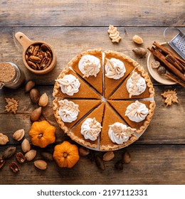 Traditional Thanksgiving Pumpkin Pie Cut Into Slices Overhead View