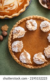 Traditional Thanksgiving Pumpkin Pie With Flaky Crust Topped With Whipped Cream Overhead View