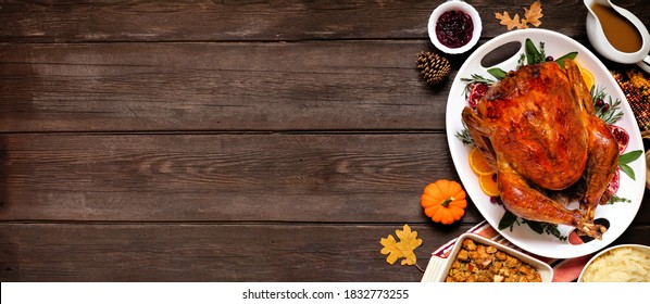 Traditional Thanksgiving Turkey Dinner. Overhead View Side Border On A Dark Wood Banner Background With Copy Space.