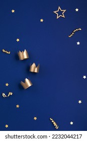 Traditional Three King's Day of January 6. Three gold crowns on blue background. Concept for Dia de Reyes Magos day, three Wise Men. Happy Epiphany day. Top view, copy space, flat lay. - Shutterstock ID 2232044217