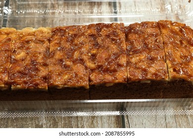 Traditional Toffee Cake Serving In The Plastic Box. Famous And Classic Mocha Sponge Cake Topping With Caramel And Macadamia Nut. 