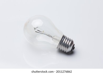 Traditional transparent glass bulb, bulb that works with electric energy, heating the filaments and giving light of a color of about 3500 degrees kelving. Incandescent bulb