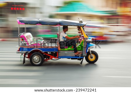traditional tuk-tuk from Bangkok, Thailand, in motion blur