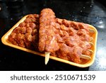 Traditional Turkish Adana kebab. General and close-up images of raw Adana kebab waiting to be cooked. Adana kebab recipe prepared with minced lamb. Traditional Turkish cuisine.
