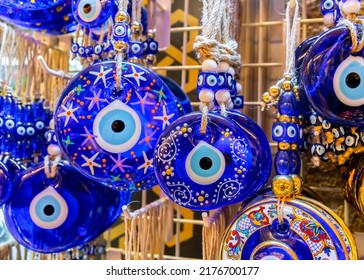 Traditional Turkish amulet Evil Eye or blue eye (Nazar boncugu). Souvenir of Turkey and traditional turkish amulet - Shutterstock ID 2176700177