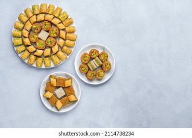 Traditional turkish, arabic dessert baklava assortment with pistachio. Ramadan sweets. Top view, copy space - Shutterstock ID 2114738234