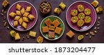 Traditional turkish, arabic sweets baklava assortment with pistachio. Top view, copy space. Banner