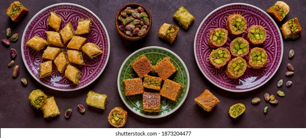 Traditional turkish, arabic sweets baklava assortment with pistachio. Top view, copy space. Banner - Shutterstock ID 1873204477