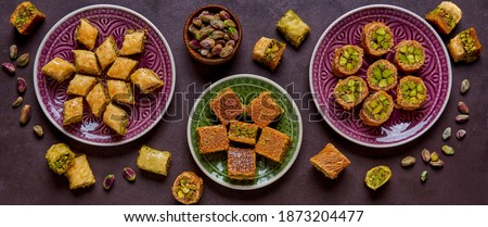 Traditional turkish, arabic sweets baklava assortment with pistachio. Top view, copy space. Banner