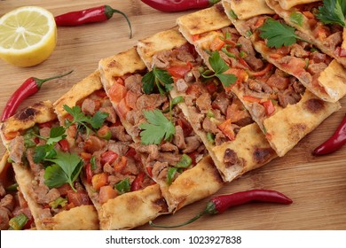 Traditional turkish baked dish pide. Turkish pizza pide, Middle eastern appetizers. Turkish cuisine. Top view. Pide with meat filling. 