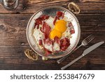 Traditional Turkish breakfast eggs with fried pastrami or bacon. Turkish name Pastirmali yumurta