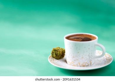 traditional Turkish coffee and Turkish delight. Traditional turkish delicacies on green smoky background