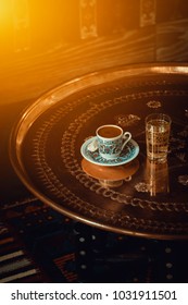 Traditional Turkish Coffee And Glass Of Water On Retro Copper Tray