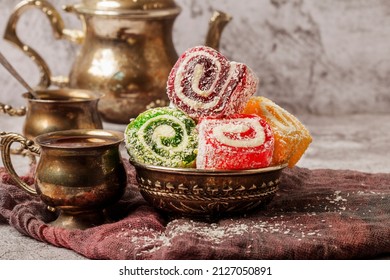 Traditional Turkish delight with Turkish tea on gray background. Ramadan Kareem celebration concept. Fragrant Turkish tea and Turkish sweets in national dishes. - Shutterstock ID 2127050891