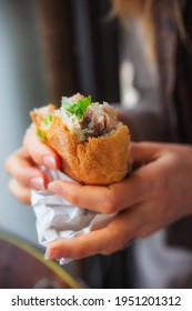 Traditional Turkish Fast Food Fish With Bread In The Hands Of A Woman. Fast Food 