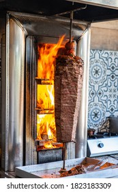 Traditional Turkish food Doner Kebab. Turnspit skewing kebap or kebab on metal skewer in the kebab restaurant. - Shutterstock ID 1823183309
