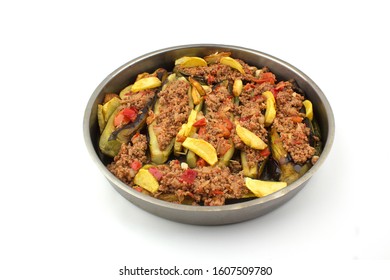 Traditional Turkish food. Slops. Eggplant Food. Juicy dish with potatoes, minced meat and eggplant. Shooting at eye level. Isolated shots on white ground. On a metal tray. Centered work - Shutterstock ID 1607509780