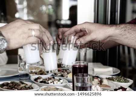 Similar – Freunde am Tisch mit frischer Limonade, die Spaß macht.