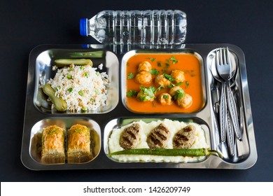 Traditional Turkish meals,meatballs soup,rice,mashed potatoes,grilled meatball and two slices of baklava in stainless steel food tray.Table d'hote,known Tabldot in Turkey 