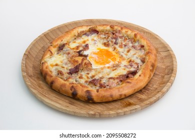 Traditional Turkish Pita Bread With Beefa And Sunny Side Up Egg On Wood Serving Plate Isolated On White. Turkish Pizza With Meat And Egg On Wooden Pizza Plate.