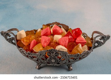 Traditional Turkish Ramadan sweet sugar candy, colorful candies in a silver bowl for Feast of Ramadan greetings.