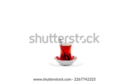 Traditional turkish tea in clear glass isolated and  on white background. Traditional turkish tea isolated. Concept view idea photo hd high quality. Hot beverage red black tea. 