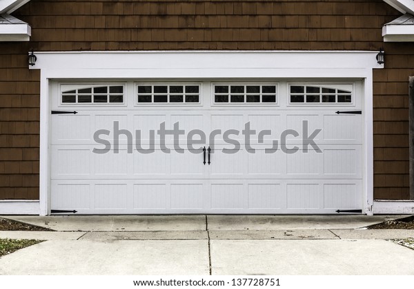 Traditional two car wooden\
garage