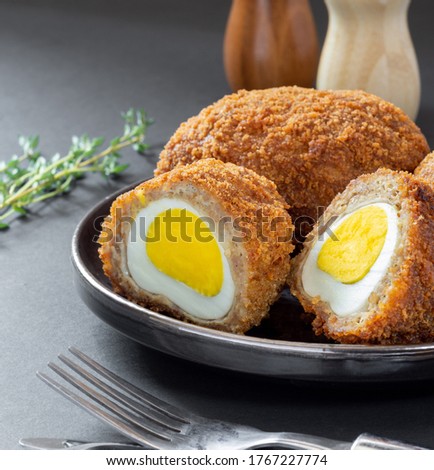 Traditional UK food, Scottish eggs, meatballs stuffed with egg in breadcrumbs.