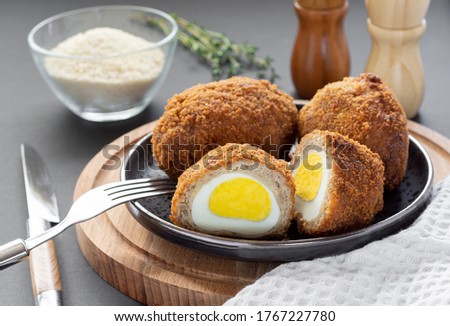 Traditional UK food, Scottish eggs, meatballs stuffed with egg in breadcrumbs.
