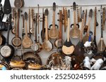 The traditional uzbek musical instruments such as rubab, sato, dutor and doira for sale. Bukhara. Uzbekistan