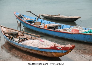 Traditional Vietnamese fishing boats carrying nets and moored at Duy Vinh Fishing Village in Vietnam - Shutterstock ID 1911524956