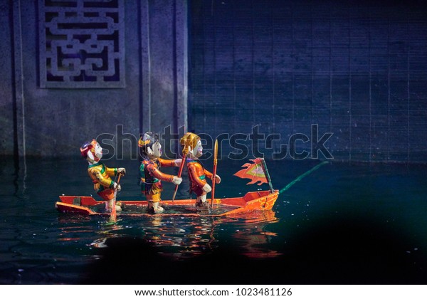 Traditional Vietnamese water puppet show in\
Hanoi, Vietnam.
