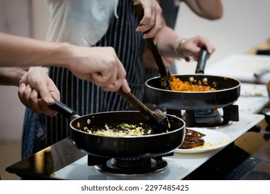 Traditional way of preparing indian food aloo gobi (potatoes with cauliflower) using gas pan. Picture of traditional India cuisine made of fresh ingredients taken during cooking class in Goa - Powered by Shutterstock