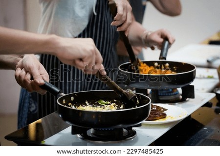 Traditional way of preparing indian food aloo gobi (potatoes with cauliflower) using gas pan. Picture of traditional India cuisine made of fresh ingredients taken during cooking class in Goa