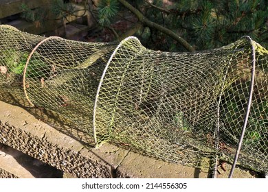 Traditional weathered fish-trap drying in the sun
