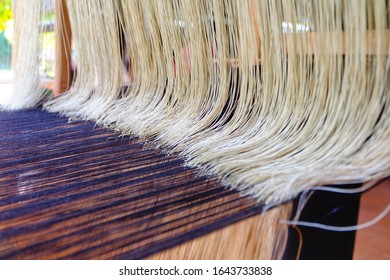 Traditional weaving loom with colorful cotton fiber being woven into clothing.  - Shutterstock ID 1643733838