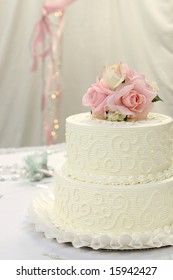 Traditional Wedding Cake With Pink And Cream Rose Cake Topper.