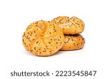 Traditional white kaiser roll with linseeds and sesame seeds isolated on white background.