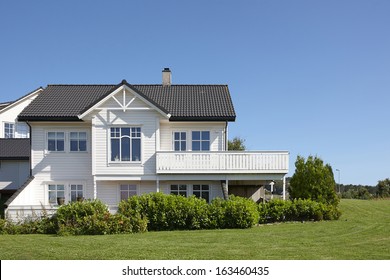 Traditional White Wooden House In Norway, Summer Day