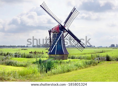 A traditional windmill on the countryside in the Netherlands