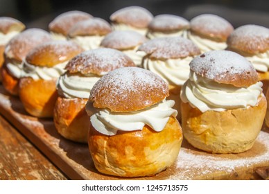Traditional winter sweet: Semla or semlor, flavored with cardamom, filled with almond paste & whipped cream from Sweden, Finland, Estonia, Norway & Denmark for Shrove Monday, fat Tuesday & Easter
