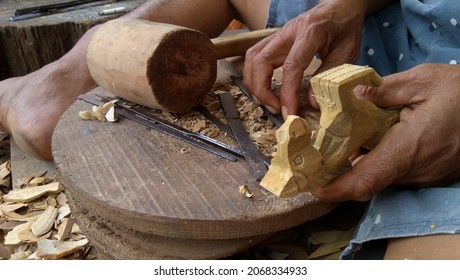 Traditional Wood Carving, Holding Sculptures