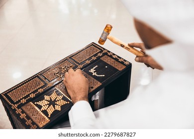 Traditional wooden Bahraini craftsmen making old wooden box