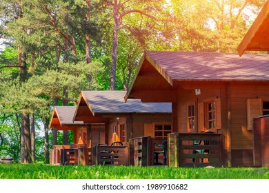 Traditional wooden camping cottages at sunny day in the countryside. Soft focus. - Powered by Shutterstock