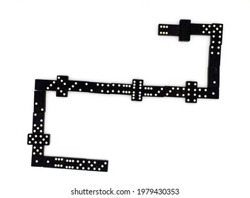 Traditional Wooden Dominoes Being Used For A Game.  Direct Overhead Shot.  Wite Background 