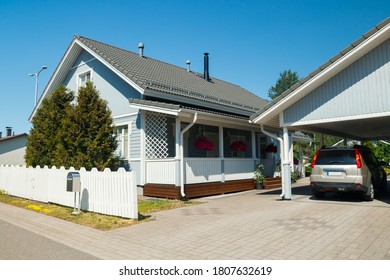 Traditional Wooden House Decorated With Flowers In Finland