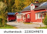 Traditional wooden house or farm near the forest. Sunny day. Early autumn in Finland. Idyllic rural scene, country landscape. Nature, remote places, village, farming, harvesting, ecotourism themes